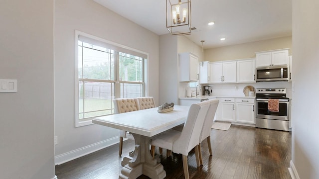 1197 Ewing Way, Clarksville, TN 37043 - dining room featuring healthy amount of natural light, a chandelier, dark wood-style floors, and recessed lighting