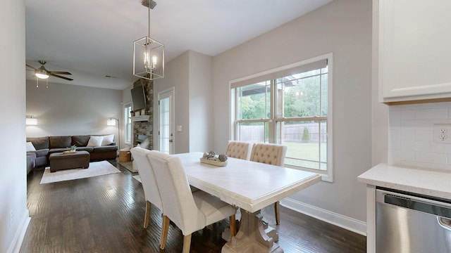 1197 Ewing Way, Clarksville, TN 37043 - dining space with dark wood-style flooring, ceiling fan, and a fireplace