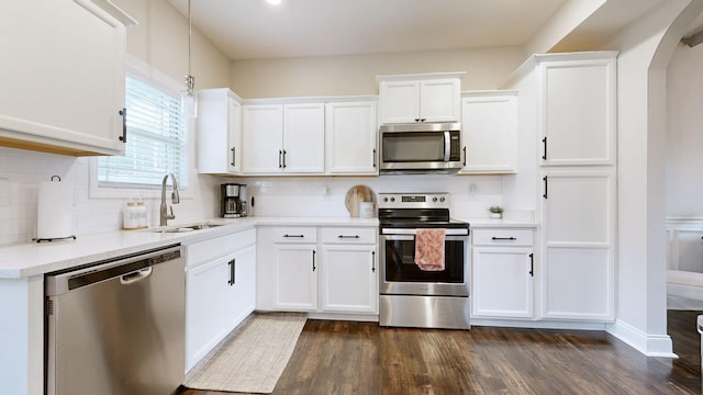 1197 Ewing Way, Clarksville, TN 37043 - kitchen featuring stainless steel appliances, white cabinets, tasteful backsplash, light countertops, and dark wood-type flooring