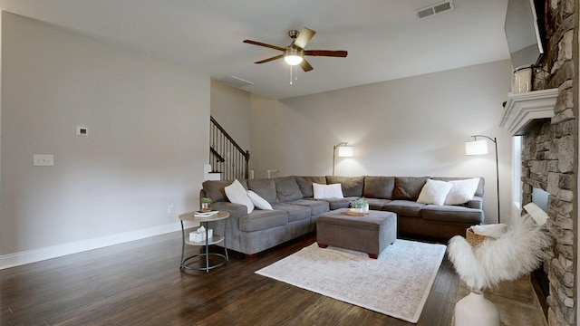 1197 Ewing Way, Clarksville, TN 37043 - living room with a ceiling fan, dark wood-style floors, stairs, and a stone fireplace