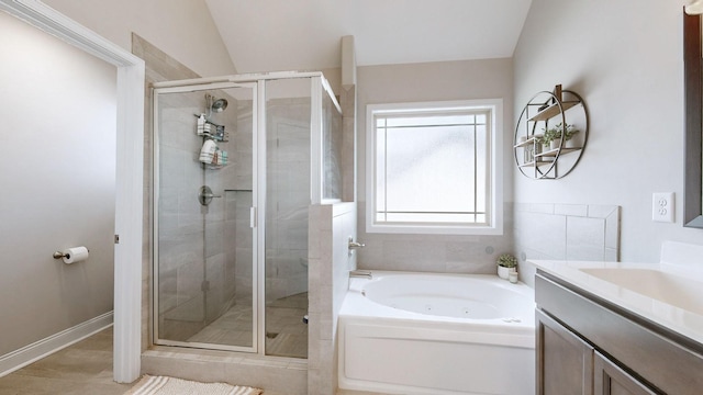 1197 Ewing Way, Clarksville, TN 37043 - full bathroom with a tub with jets, a shower stall, vanity, and lofted ceiling