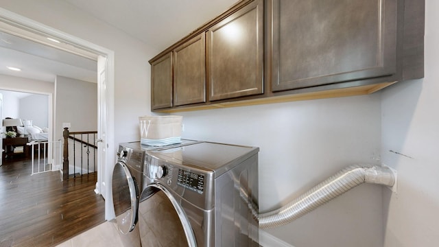 1197 Ewing Way, Clarksville, TN 37043 - laundry room featuring cabinet space, washer and dryer, and dark wood-style floors