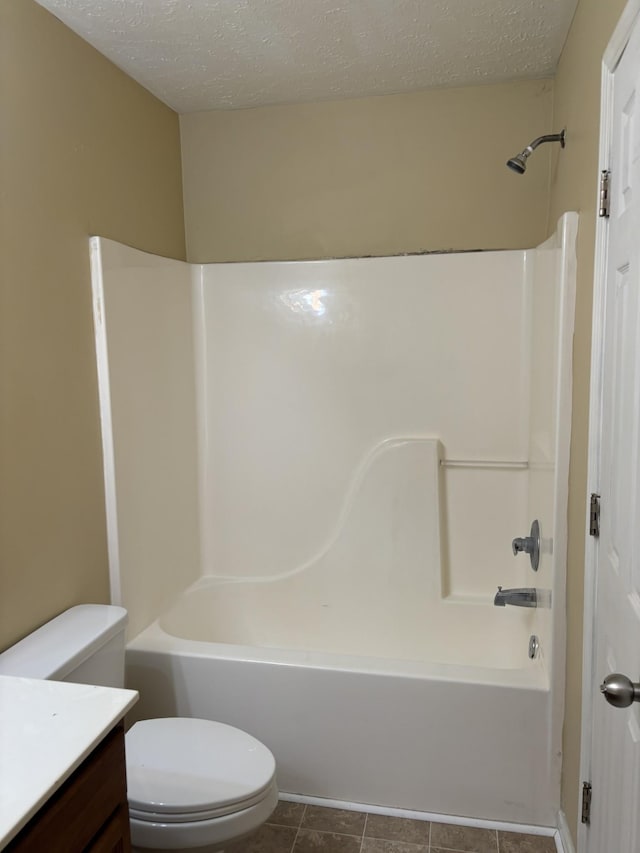 1023 Sitting Bull Xing, Murfreesboro, TN 37128 - bathroom featuring vanity, washtub / shower combination, a textured ceiling, and tile patterned flooring