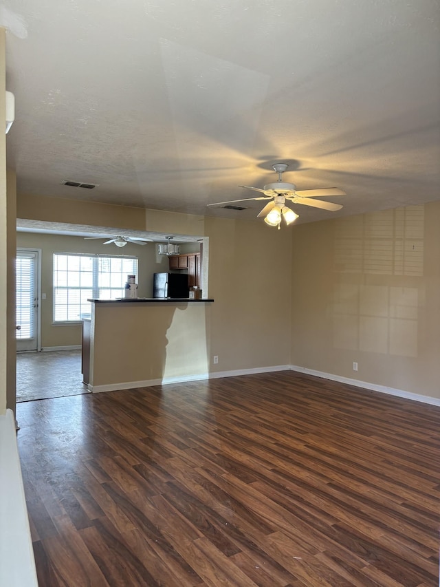 1023 Sitting Bull Xing, Murfreesboro, TN 37128 - unfurnished living room with ceiling fan and dark wood-type flooring
