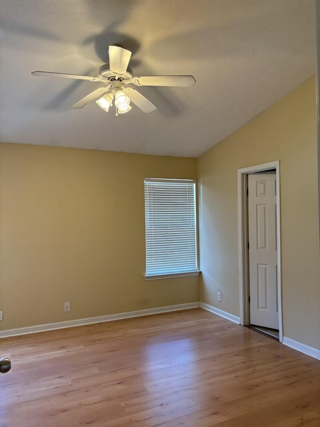 1023 Sitting Bull Xing, Murfreesboro, TN 37128 - unfurnished room with wood finished floors, lofted ceiling, and a ceiling fan