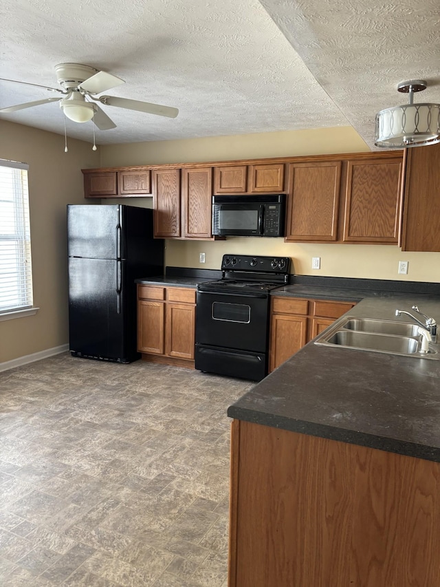 1023 Sitting Bull Xing, Murfreesboro, TN 37128 - kitchen featuring black appliances, brown cabinetry, dark countertops, ceiling fan, and a textured ceiling