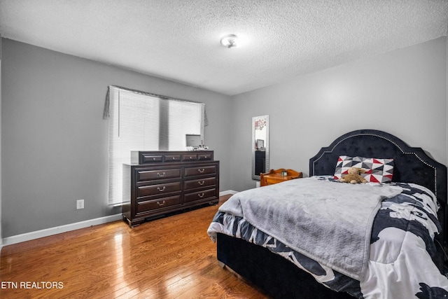 602 Mize Cir, Seymour, TN 37865 - bedroom with wood finished floors and a textured ceiling