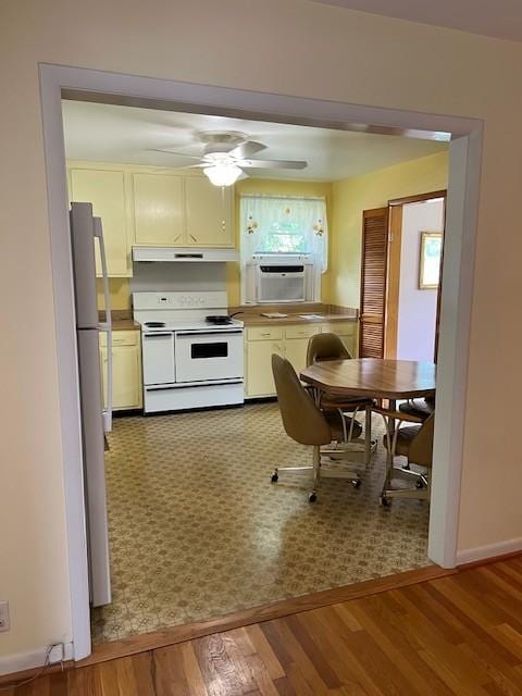 4805 Bowfield Dr, Antioch, TN 37013 - kitchen with white appliances, wood finished floors, under cabinet range hood, and a ceiling fan