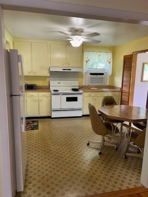 4805 Bowfield Dr, Antioch, TN 37013 - kitchen featuring white appliances, cooling unit, under cabinet range hood, and cream cabinetry