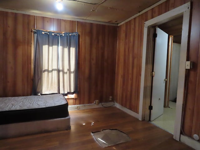 910 17th Ave E, Springfield, TN 37172 - bedroom featuring wood walls, wood finished floors, and ornamental molding
