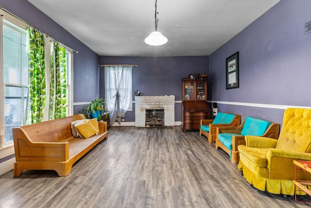 104 3rd Ave, Columbia, TN 38401 - living area featuring wood finished floors and a brick fireplace