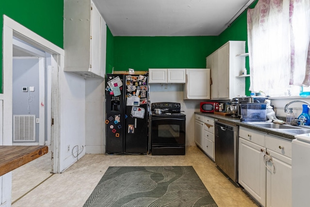 104 3rd Ave, Columbia, TN 38401 - kitchen featuring black appliances, light flooring, white cabinetry, and dark countertops