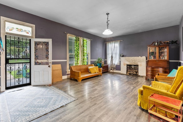 104 3rd Ave, Columbia, TN 38401 - living area featuring wood finished floors and a brick fireplace