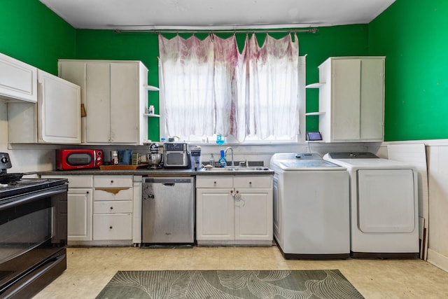 104 3rd Ave, Columbia, TN 38401 - kitchen with dishwasher, black range with electric stovetop, washing machine and dryer, dark countertops, and white cabinets