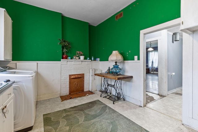 104 3rd Ave, Columbia, TN 38401 - laundry room with cabinet space, washer / clothes dryer, and a brick fireplace