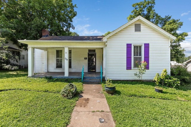 104 3rd Ave, Columbia, TN 38401 - view of front of property featuring a porch, a front lawn, and a chimney