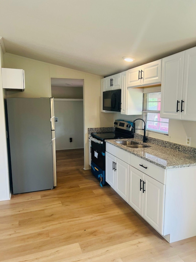 11120 Central Pike, Mount Juliet, TN 37122 - kitchen featuring appliances with stainless steel finishes, light wood-type flooring, white cabinetry, and light stone counters