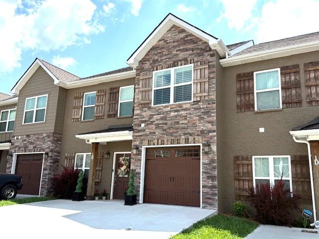 967 Horse Mountain Rd Unit 1E, Shelbyville, TN 37160 - multi unit property with stone siding, driveway, and an attached garage