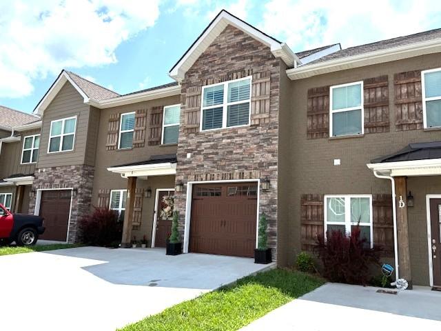 967 Horse Mountain Rd Unit 1E, Shelbyville, TN 37160 - multi unit property with stone siding, concrete driveway, and an attached garage