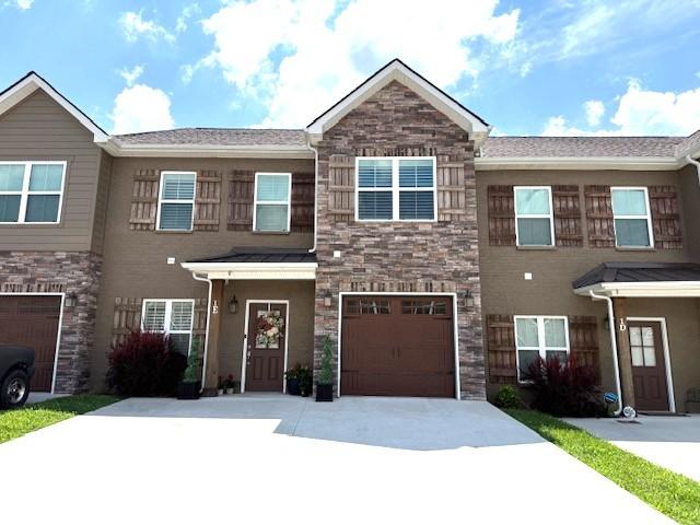 967 Horse Mountain Rd Unit 1E, Shelbyville, TN 37160 - multi unit property with driveway, an attached garage, and stone siding