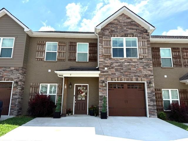 967 Horse Mountain Rd Unit 1E, Shelbyville, TN 37160 - multi unit property with stone siding, driveway, and a garage