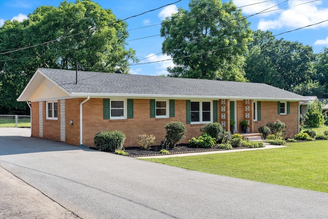 1211 Taylor Pl, Murfreesboro, TN 37129 - ranch-style house with brick siding, a shingled roof, and driveway