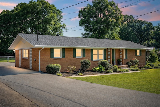 1211 Taylor Pl, Murfreesboro, TN 37129 - ranch-style house with brick siding, roof with shingles, and driveway