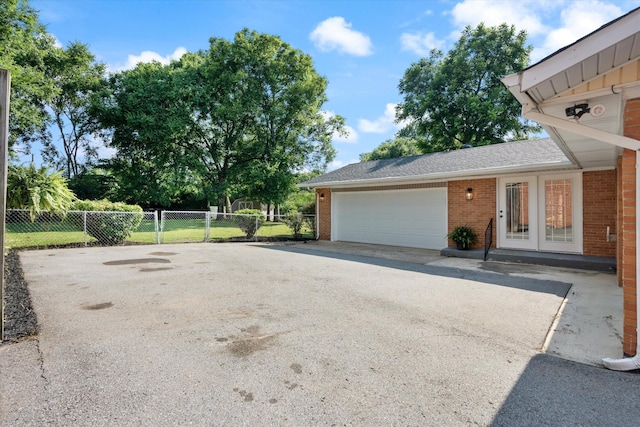 1211 Taylor Pl, Murfreesboro, TN 37129 - view of side of home featuring brick siding and a garage
