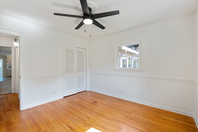 1211 Taylor Pl, Murfreesboro, TN 37129 - unfurnished bedroom featuring a closet, light wood-style floors, and a ceiling fan