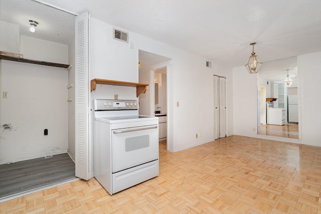 3880 Priest Lake Dr Unit 21, Nashville, TN 37217 - kitchen featuring white appliances, washer / dryer, a chandelier, and hanging light fixtures