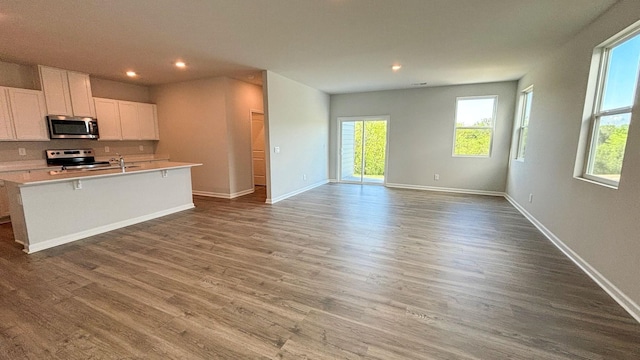 4902 Mowbray Way, Murfreesboro, TN 37129 - kitchen with stainless steel appliances, recessed lighting, white cabinets, wood finished floors, and plenty of natural light