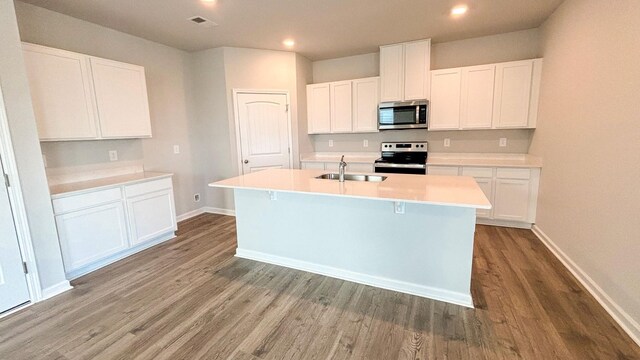 4902 Mowbray Way, Murfreesboro, TN 37129 - kitchen featuring appliances with stainless steel finishes, an island with sink, wood finished floors, white cabinets, and recessed lighting