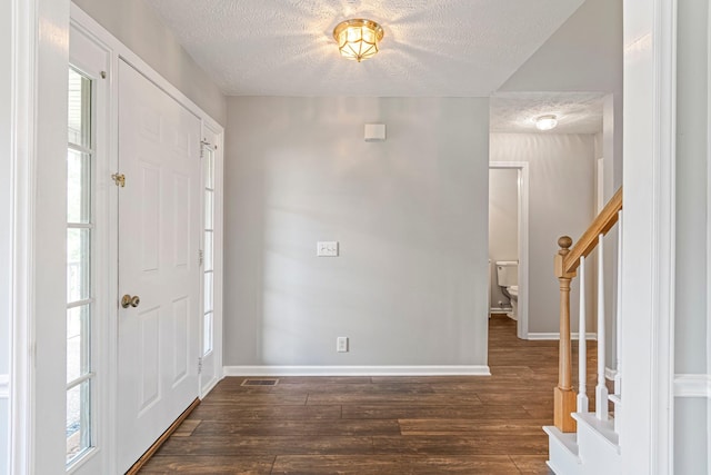 2415 Franklin Ln, Murfreesboro, TN 37130 - entryway with a textured ceiling, stairway, and dark wood-type flooring