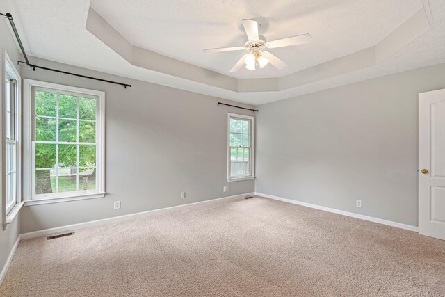 2415 Franklin Ln, Murfreesboro, TN 37130 - carpeted empty room with a raised ceiling and ceiling fan