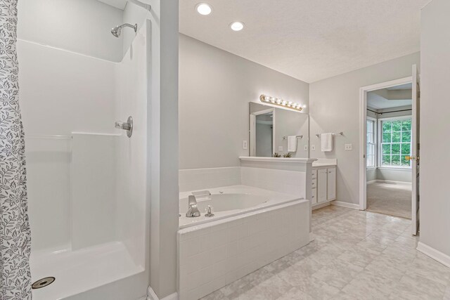 2415 Franklin Ln, Murfreesboro, TN 37130 - bathroom featuring vanity, a shower stall, a bath, and recessed lighting