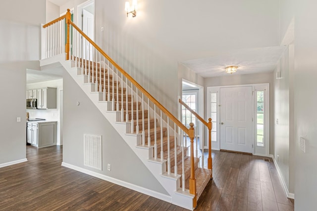 2415 Franklin Ln, Murfreesboro, TN 37130 - foyer entrance with dark wood-style floors, stairs, plenty of natural light, and a high ceiling