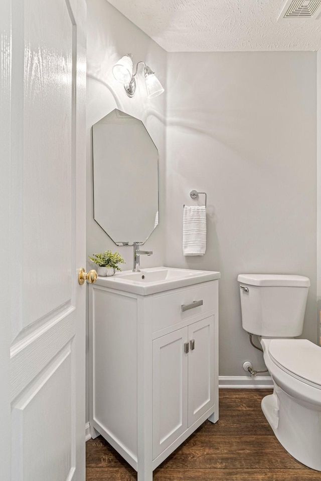 2415 Franklin Ln, Murfreesboro, TN 37130 - bathroom featuring vanity, wood finished floors, and a textured ceiling