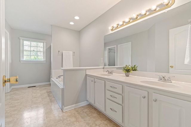 2415 Franklin Ln, Murfreesboro, TN 37130 - bathroom with double vanity, a garden tub, and recessed lighting