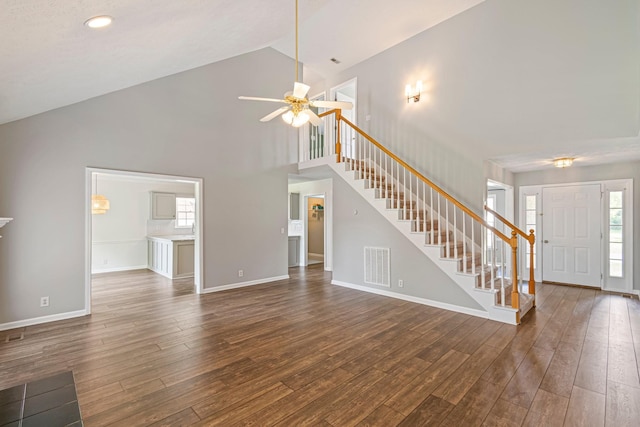 2415 Franklin Ln, Murfreesboro, TN 37130 - unfurnished living room featuring stairway, dark wood-style flooring, a ceiling fan, high vaulted ceiling, and recessed lighting