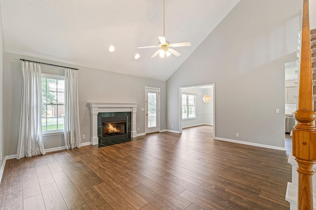 2415 Franklin Ln, Murfreesboro, TN 37130 - unfurnished living room featuring ceiling fan, plenty of natural light, high vaulted ceiling, a tile fireplace, and dark wood finished floors