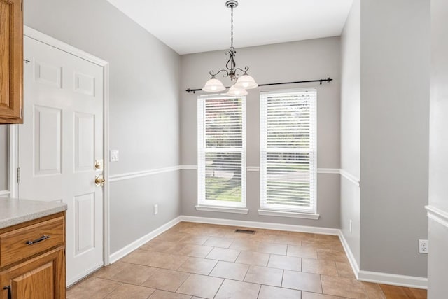 4416 Churchill Pl, Old Hickory, TN 37138 - unfurnished dining area featuring a chandelier, healthy amount of natural light, and light tile patterned flooring