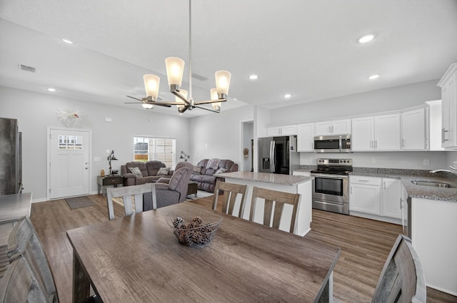 77 Frost St, Decherd, TN 37324 - dining area featuring wood finished floors, a chandelier, recessed lighting, and ceiling fan