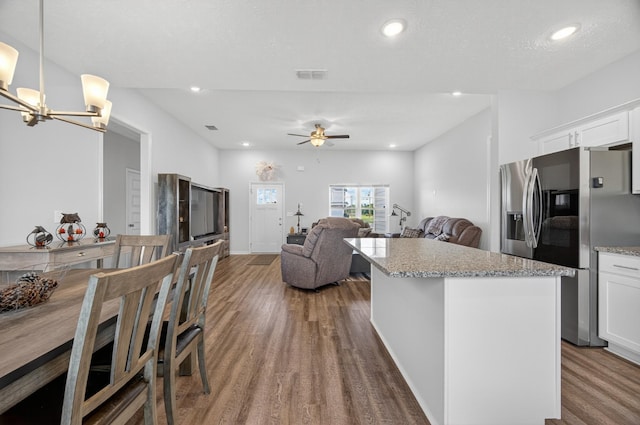 77 Frost St, Decherd, TN 37324 - kitchen featuring stainless steel refrigerator with ice dispenser, wood finished floors, a center island, white cabinets, and recessed lighting