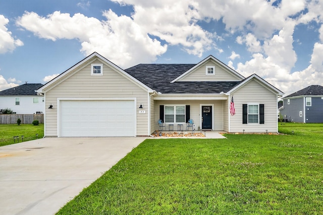 77 Frost St, Decherd, TN 37324 - view of front facade featuring a garage, covered porch, concrete driveway, and a front yard