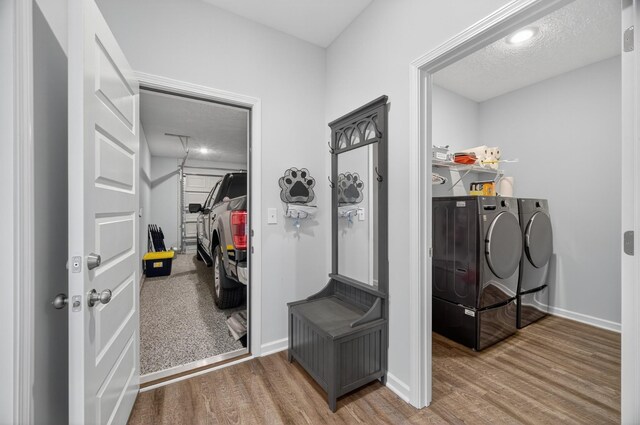 77 Frost St, Decherd, TN 37324 - laundry area with independent washer and dryer, wood finished floors, and a textured ceiling