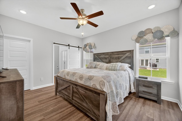 77 Frost St, Decherd, TN 37324 - bedroom featuring wood finished floors, a barn door, and ceiling fan