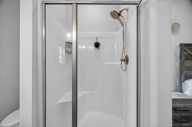 77 Frost St, Decherd, TN 37324 - bathroom featuring a stall shower and toilet