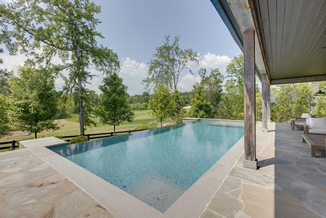 7555 Whiskey Rd, College Grove, TN 37046 - view of pool featuring a patio and an infinity pool