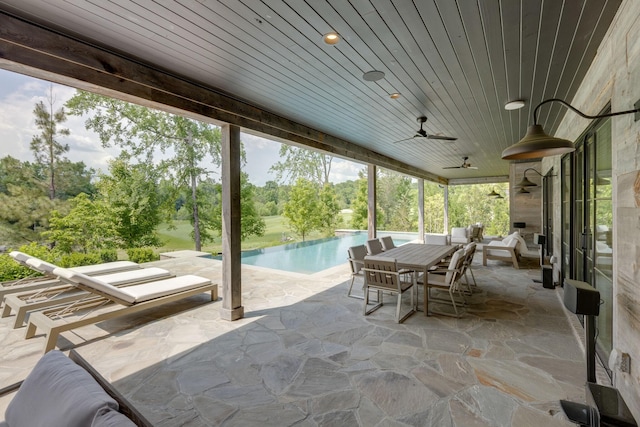 7555 Whiskey Rd, College Grove, TN 37046 - view of patio / terrace featuring a ceiling fan, an outdoor pool, outdoor dining area, and view of scattered trees