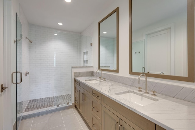 7555 Whiskey Rd, College Grove, TN 37046 - bathroom featuring double vanity, a stall shower, tile patterned floors, and recessed lighting